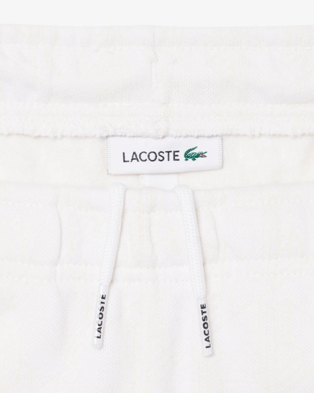 Pantaloni della tuta con monogramma 947110 W8L LACOSTE 