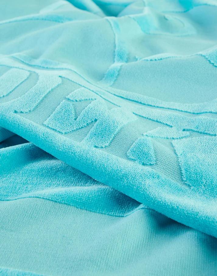 Telo in spugna jacquard con logo e cornice Blue Java AM372ATC1000 A7300 SUNDEK 
